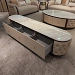 Cream Tufted Leather TV Stand with Oval Marble Top and Dark Glossy Frame